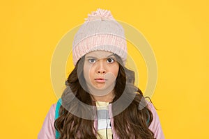 Style guide. Winter hat styles. Kid girl wear knitted hat. Winter accessory concept. Girl long hair yellow background
