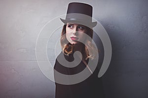 Style and mystique redhead girl in top hat