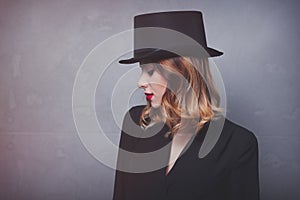 Style and mystique redhead girl in top hat