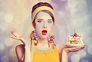 Style redhead girl with cake.