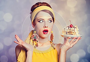 Style redhead girl with cake.