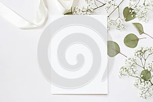 Styled stock photo. Feminine wedding desktop stationery mockup with blank greeting card, baby`s breath Gypsophila