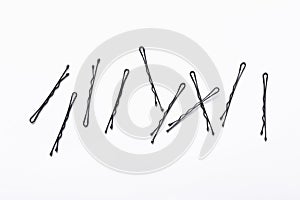 Styling black metal hairpins isolated on white background