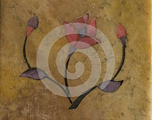 Stylised flower inlaid on stone