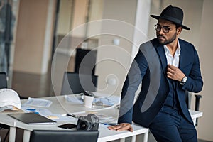 Stylish actor is posing to the camera