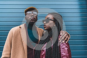 stylish african american couple in fashionable clothes posing