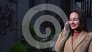 Stylish american portrait. Woman talking phone outside in american style