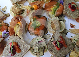 A stylish arrangement for the wedding guests with salmon, ham, pies and fruits photo