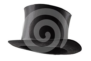 Stylish attire, vintage men fashion and magic show conceptual idea with 3/4 angle on victorian black top hat with clipping path