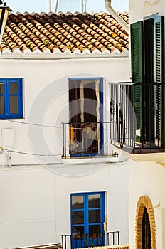 Stylish balcony with a metal railing, solid architectural elemen