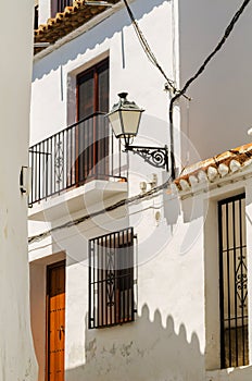 Stylish balcony with a metal railing, solid architectural elemen