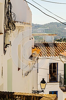 Stylish balcony with a metal railing, solid architectural elemen