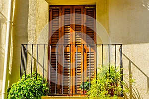 Stylish balcony with a metal railing, solid architectural element, a place of rest and relaxation, vintage decor