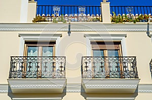 Stylish balcony with a metal railing, solid architectural element, a place of rest and relaxation