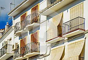 Stylish balcony with a metal railing, solid architectural element, a place of rest and relaxation