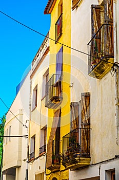 Stylish balcony with a metal railing, solid architectural element, a place of rest and relaxation, vintage decor