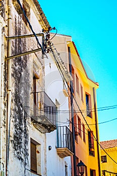 Stylish balcony with a metal railing, solid architectural element, a place of rest and relaxation, vintage decor