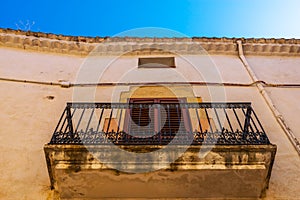 Stylish balcony with a metal railing, solid architectural element, a place of rest and relaxation, vintage decor