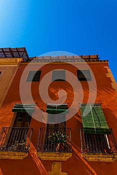 Stylish balcony with a metal railing, solid architectural element, a place of rest and relaxation, vintage decor