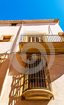 Stylish balcony with a metal railing, solid architectural element, a place of rest and relaxation, vintage decor