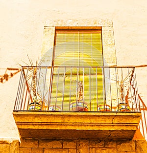 Stylish balcony with a metal railing, solid architectural element, a place of rest and relaxation, vintage decor