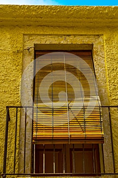 Stylish balcony with a metal railing, solid architectural element, a place of rest and relaxation, vintage decor