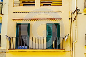 Stylish balcony with a metal railing, solid architectural element, a place of rest and relaxation, vintage decor