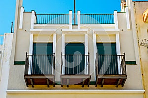 Stylish balcony with a metal railing, solid architectural element, a place of rest and relaxation, vintage decor