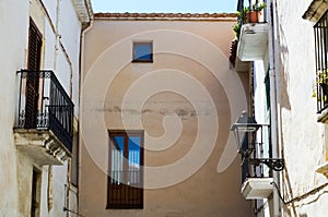 Stylish balcony with a metal railing, solid architectural element, a place of rest and relaxation, vintage decor