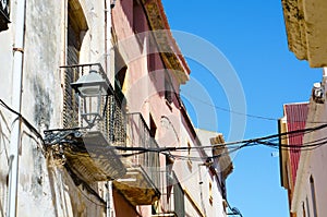 Stylish balcony with a metal railing, solid architectural element, a place of rest and relaxation, vintage decor