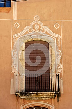 Stylish balcony with a metal railing, solid architectural element, a place of rest and relaxation, vintage decor