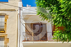 Stylish balcony with a metal railing, solid architectural element, a place of rest and relaxation, vintage decor