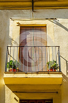 Stylish balcony with a metal railing, solid architectural element, a place of rest and relaxation, vintage decor