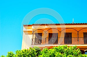 Stylish balcony with a metal railing, solid architectural element, a place of rest and relaxation, vintage decor