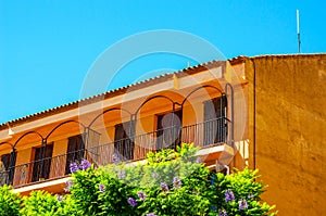 Stylish balcony with a metal railing, solid architectural element, a place of rest and relaxation, vintage decor