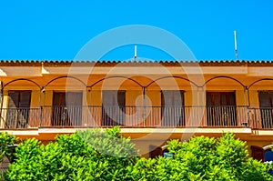 Stylish balcony with a metal railing, solid architectural element, a place of rest and relaxation, vintage decor