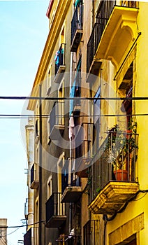 Stylish balcony with a metal railing, solid architectural element, a place of rest and relaxation, vintage decor