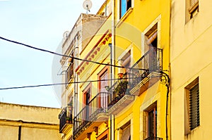 Stylish balcony with a metal railing, solid architectural element, a place of rest and relaxation, vintage decor