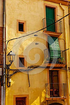 Stylish balcony with a metal railing, solid architectural element, a place of rest and relaxation, vintage decor