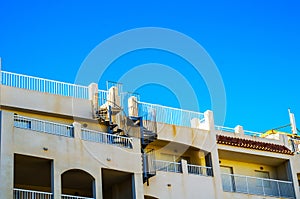 Stylish balcony with a metal railing, solid architectural element, a place of rest and relaxation, vintage decor