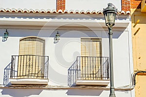 Stylish balcony with a metal railing, solid architectural element, a place of rest and relaxation, vintage decor