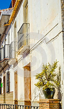 Stylish balcony with a metal railing, solid architectural element, a place of rest and relaxation, vintage decor