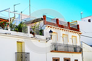 Stylish balcony with a metal railing, solid architectural element, a place of rest and relaxation, vintage decor