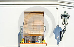 Stylish balcony with a metal railing, solid architectural element, a place of rest and relaxation, vintage decor