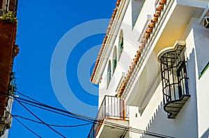 Stylish balcony with a metal railing, solid architectural element, a place of rest and relaxation, vintage decor