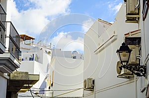 Stylish balcony with a metal railing, solid architectural element, a place of rest and relaxation, vintage decor