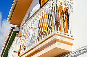 Stylish balcony with a metal railing, solid architectural element, a place of rest and relaxation, vintage decor