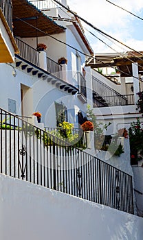 Stylish balcony with a metal railing, solid architectural element, a place of rest and relaxation, vintage decor