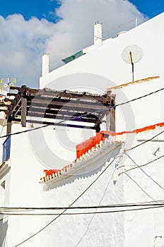 Stylish balcony with a metal railing, solid architectural element, a place of rest and relaxation, vintage decor