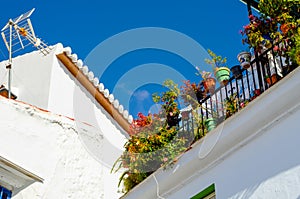 Stylish balcony with a metal railing, solid architectural element, a place of rest and relaxation, vintage decor